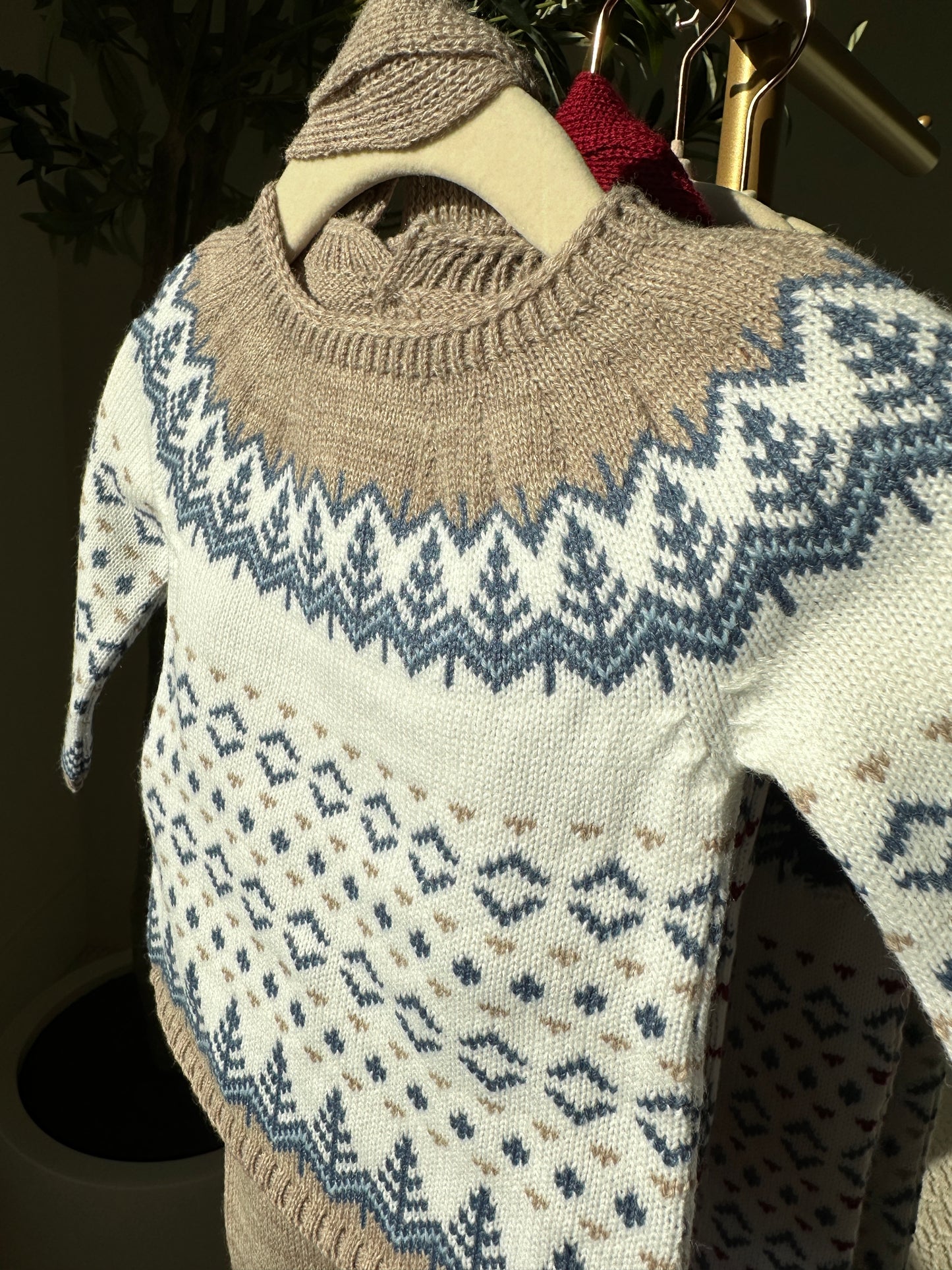 baby knitwear sweater, hat, and leggings set in winter print