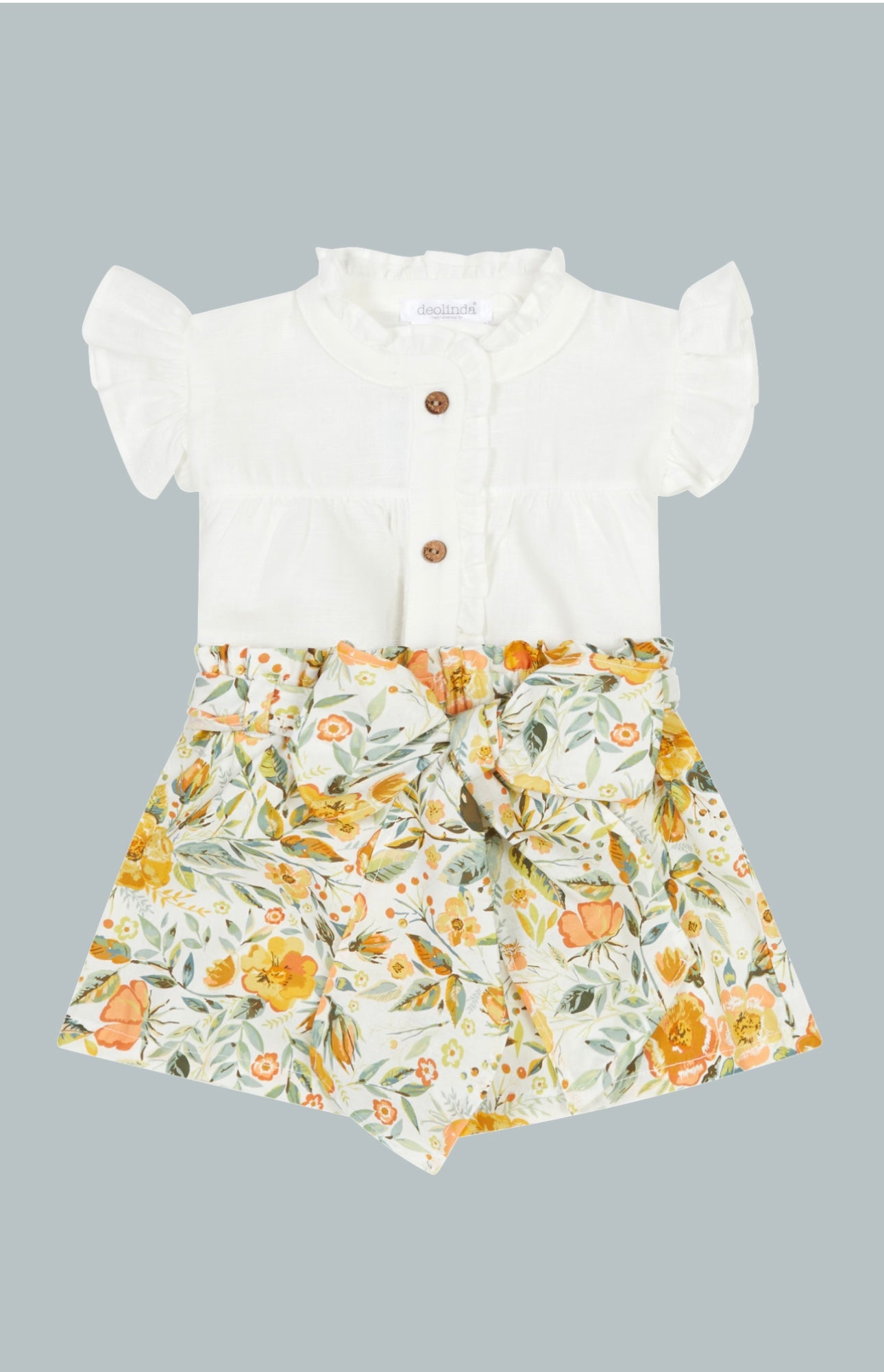 GIrl's spring and summer 2-piece outfit. Linen Blouse with yellow floral shorts