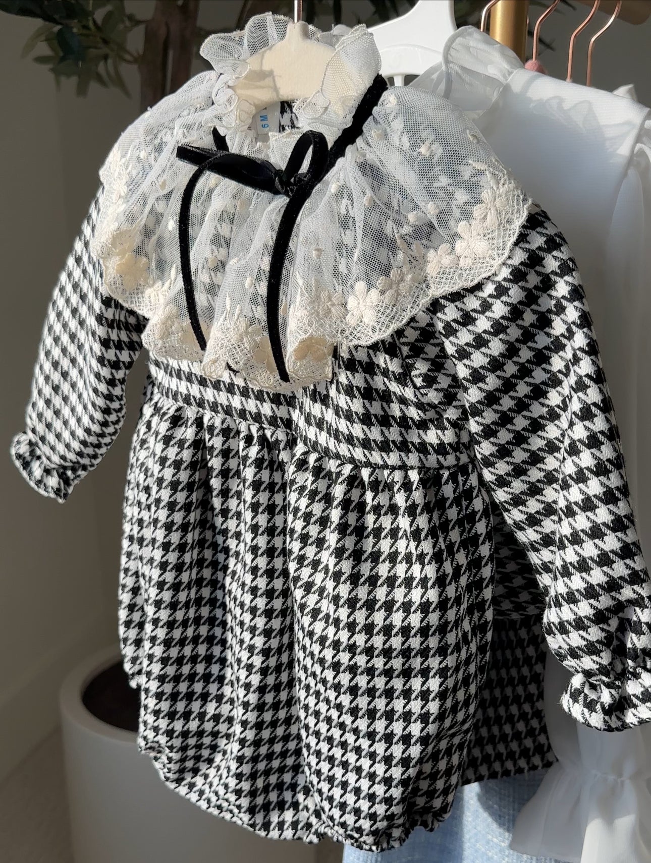 black and white houndstooth bubble romper with lace detail for toddler girls and little girls